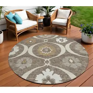 Photo of 8' Brown Beige And Taupe Round Medallion Washable Indoor Outdoor Area Rug