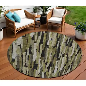 Photo of 8' Brown Black And Green Round Striped Washable Indoor Outdoor Area Rug