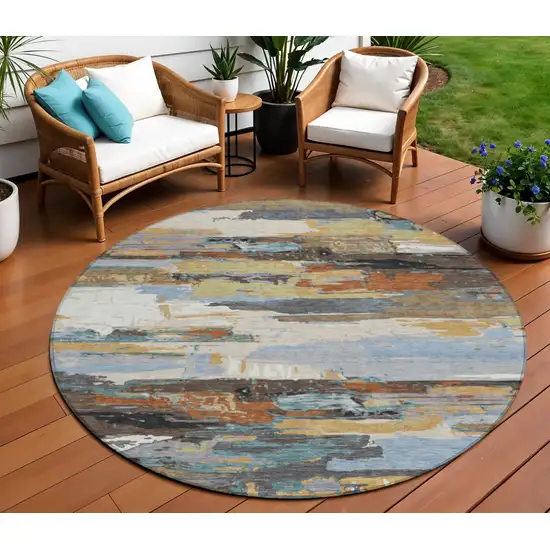 8' Brown Blue Ivory And Gold Round Abstract Washable Indoor Outdoor Area Rug Photo 1