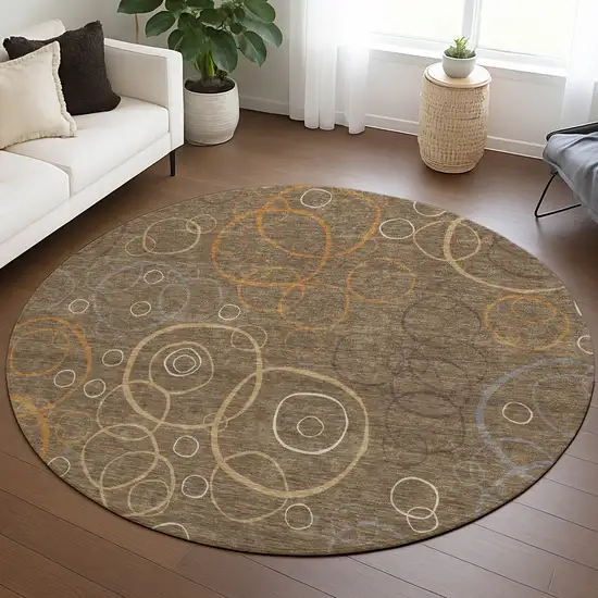 8' Brown Copper And Ivory Round Geometric Washable Indoor Outdoor Area Rug Photo 5