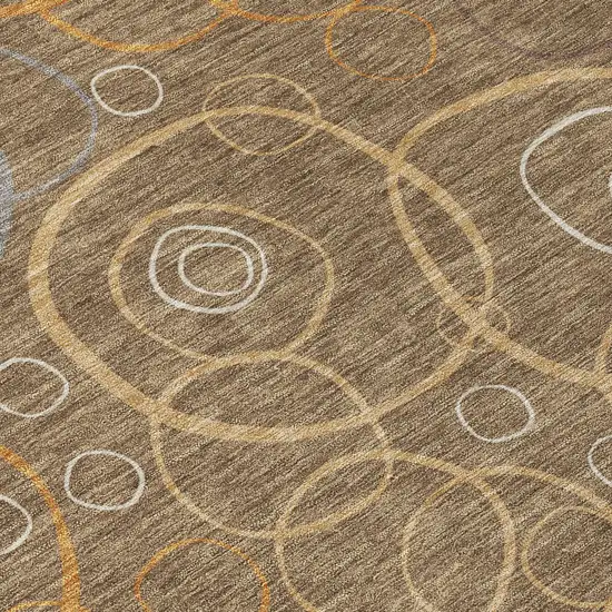 8' Brown Copper And Ivory Round Geometric Washable Indoor Outdoor Area Rug Photo 9