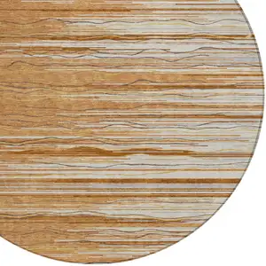 Photo of 8' Brown Copper And Ivory Round Striped Washable Indoor Outdoor Area Rug