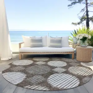 Photo of 8' Brown Gray And Ivory Round Geometric Washable Indoor Outdoor Area Rug