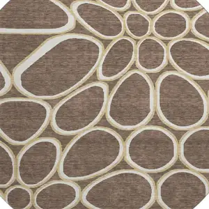 Photo of 8' Brown Ivory And Gold Geometric Washable Round Rug With UV Protection