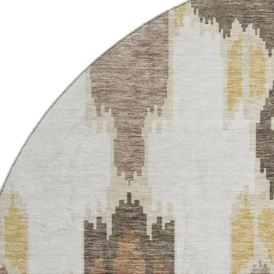 8' Brown Ivory And Gold Ikat Washable Round Rug With UV Protection Photo 3