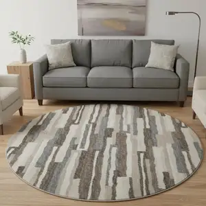 Photo of 8' Brown Ivory And Gray Abstract Washable Round Rug With UV Protection