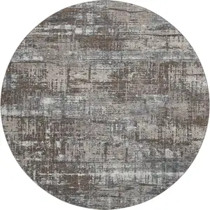 Photo of 8' Brown Taupe And Gray Geometric Washable Round Rug With UV Protection