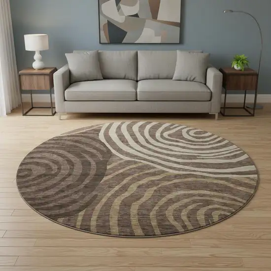 8' Brown Taupe And Ivory Abstract Washable Round Rug With UV Protection Photo 2