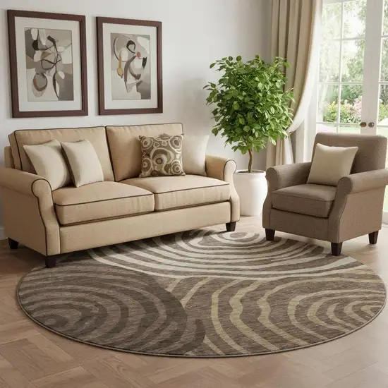 8' Brown Taupe And Ivory Abstract Washable Round Rug With UV Protection Photo 1
