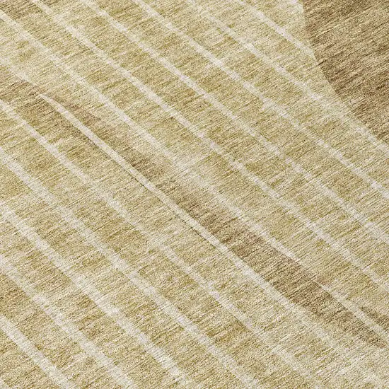 8' Brown Taupe And Ivory Round Striped Washable Indoor Outdoor Area Rug Photo 9