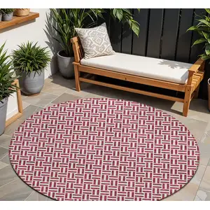 Photo of 8' Burgundy And Ivory Round Geometric Washable Indoor Outdoor Area Rug