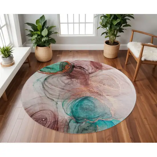 8' Burgundy Blue And Ivory Abstract Washable Round Rug With UV Protection Photo 2