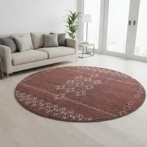 Photo of 8' Burnt Sienna Ivory And Black Tribal Washable Round Rug With UV Protection