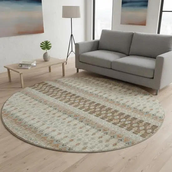 8' Burnt Sienna Ivory And Blue Tribal Washable Round Rug With UV Protection Photo 1
