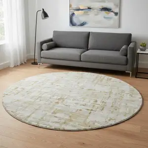 Photo of 8' Camel And Ivory Abstract Washable Round Rug With UV Protection