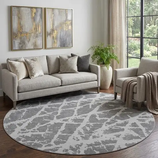 8' Charcoal And Ivory Abstract Washable Round Rug With UV Protection Photo 1