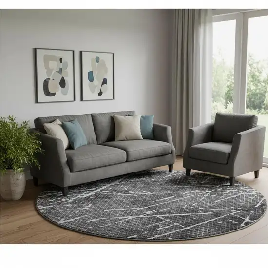8' Charcoal And Ivory Abstract Washable Round Rug With UV Protection Photo 1