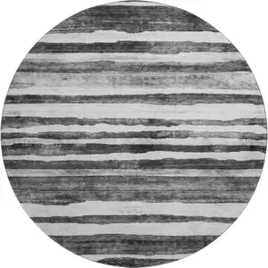 Photo of 8' Charcoal And Ivory Striped Washable Round Rug With UV Protection