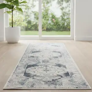 Photo of 6' Charcoal Blue And Ivory Oriental Distressed Runner Rug
