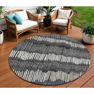 Photo of 8' Charcoal Blue And Ivory Round Striped Washable Indoor Outdoor Area Rug