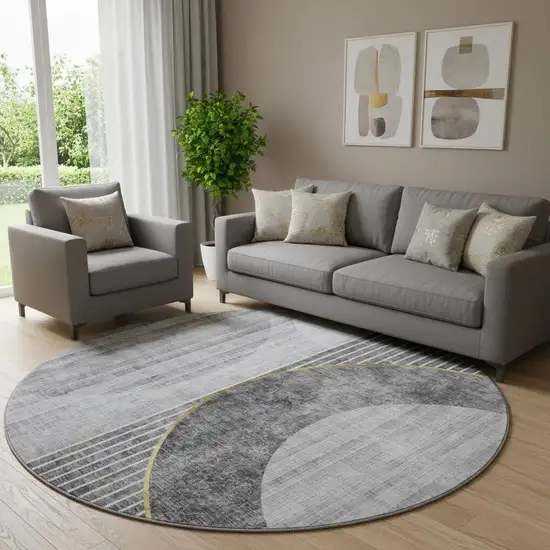 8' Charcoal Gold And Silver Geometric Washable Round Rug With UV Protection Photo 1