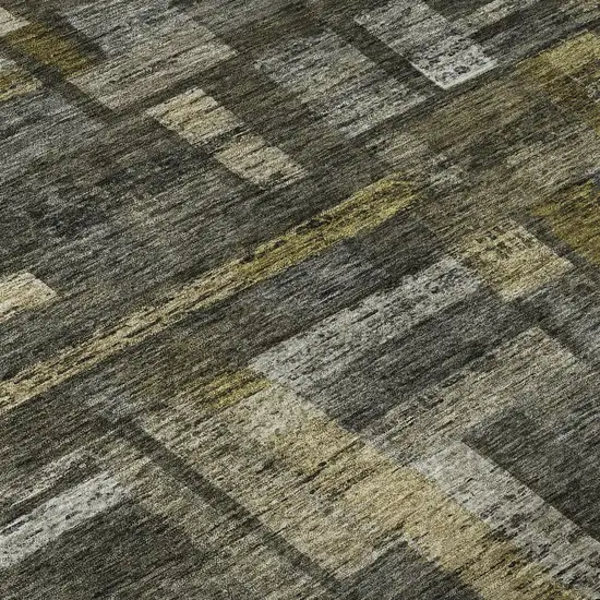 8' Charcoal Gray And Gold Striped Washable Round Rug With UV Protection Photo 8