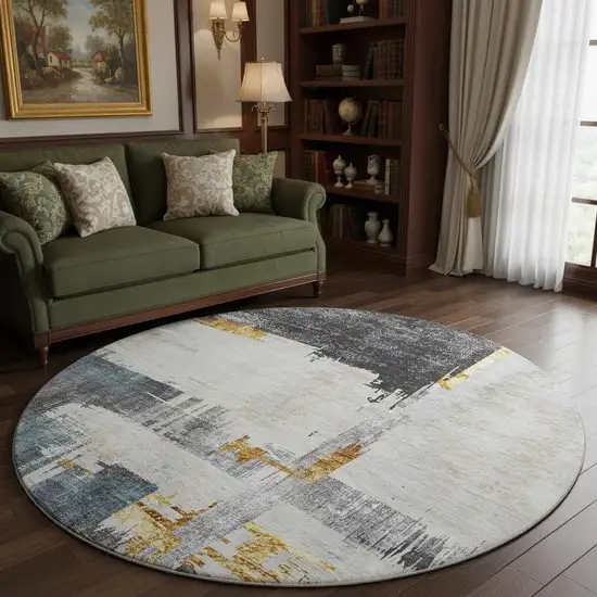 8' Charcoal Ivory And Gold Abstract Washable Round Rug With UV Protection Photo 2
