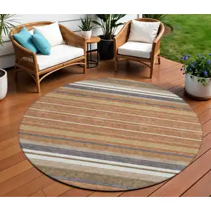Photo of 8' Chili Red Ivory And Gold Round Striped Washable Indoor Outdoor Area Rug