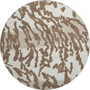 Photo of 8' Chocolate And Beige Animal Print Washable Round Rug With UV Protection