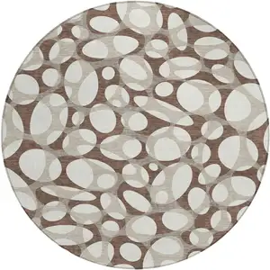 Photo of 8' Chocolate And Beige Round Abstract Washable Indoor Outdoor Area Rug