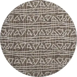 Photo of 8' Chocolate And Ivory Geometric Washable Round Rug With UV Protection