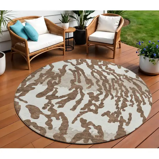 8' Chocolate Beige And Ivory Round Animal Print Washable Indoor Outdoor Area Rug Photo 1