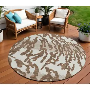 Photo of 8' Chocolate Beige And Ivory Round Animal Print Washable Indoor Outdoor Area Rug