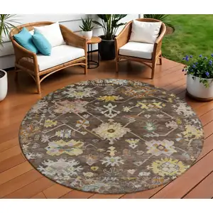 Photo of 8' Chocolate Gold And Ivory Round Floral Washable Indoor Outdoor Area Rug