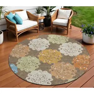 Photo of 8' Chocolate Ivory And Copper Round Quatrefoil Washable Indoor Outdoor Area Rug