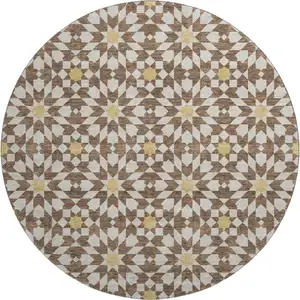 Photo of 8' Chocolate Ivory And Gold Geometric Washable Round Rug With UV Protection