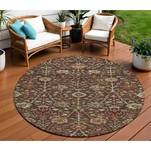 Photo of 8' Chocolate Tan And Green Round Floral Washable Indoor Outdoor Area Rug