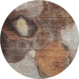 Photo of 8' Coffee Beige And Copper Abstract Washable Round Rug With UV Protection