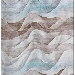Photo of 8' Coffee Blue And Ivory Abstract Washable Area Rug With UV Protection
