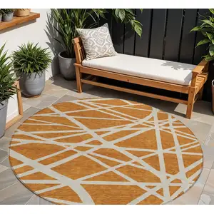 Photo of 8' Copper And Beige Round Geometric Washable Indoor Outdoor Area Rug