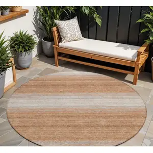 Photo of 8' Copper And Beige Round Striped Washable Indoor Outdoor Area Rug