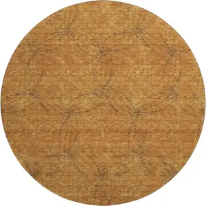 Photo of 8' Copper And Brown Geometric Washable Round Rug With UV Protection