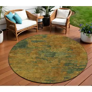 Photo of 8' Copper And Green Round Abstract Washable Indoor Outdoor Area Rug