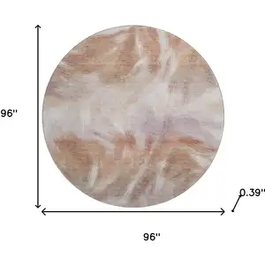 Photo of 8' Copper And Ivory Abstract Washable Round Rug With UV Protection