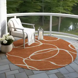 Photo of 8' Copper And Ivory Round Abstract Washable Indoor Outdoor Area Rug