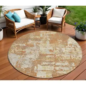 Photo of 8' Copper Gold And Ivory Round Abstract Washable Indoor Outdoor Area Rug