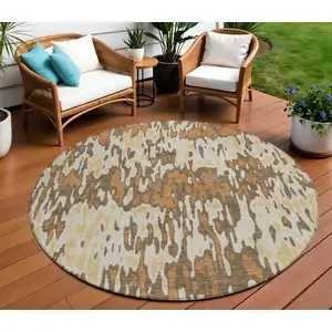 Photo of 8' Copper Gold And Ivory Round Striped Washable Indoor Outdoor Area Rug