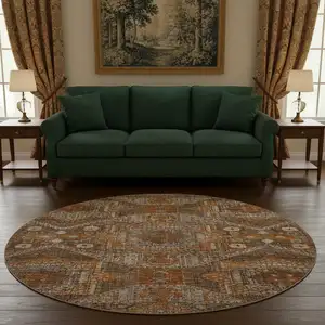 Photo of 8' Copper Rust And Beige Abstract Geometric Washable Round Rug With UV Protection