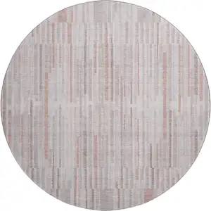 Photo of 8' Coral And Beige Striped Washable Round Rug With UV Protection