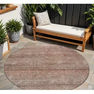 Photo of 8' Coral And Black Round Striped Washable Indoor Outdoor Area Rug